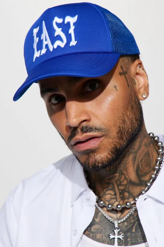 East Side Trucker Hat - Royal sold by Fashion Nova