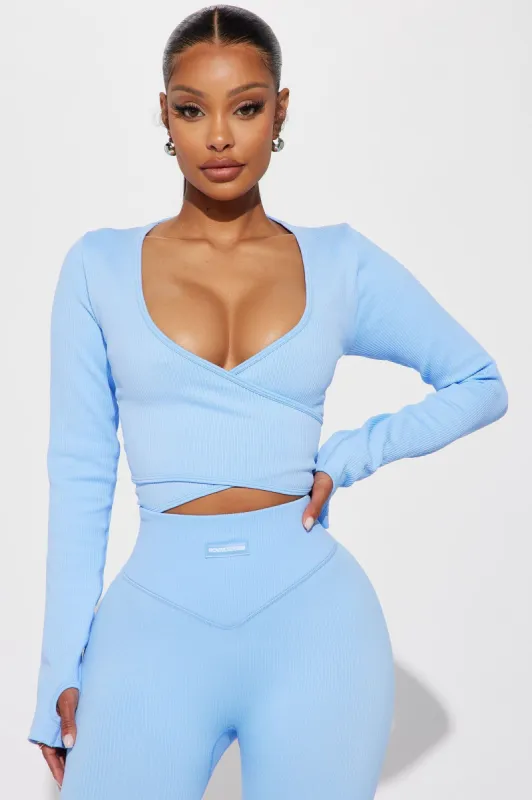 Namaste Seamless Wrap Active Top - Light Blue sold by Fashion Nova
