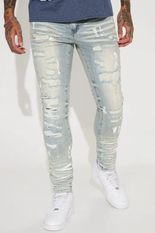 Got This Paint Splatter Ripped Stacked Skinny Jeans - Light Wash sold by Fashion Nova
