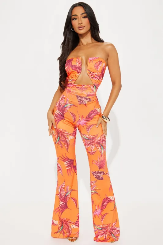 Maui Sun Tropical Jumpsuit - Orange/combo sold by Fashion Nova