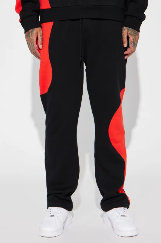 Tyson Opposite Forces Straight Sweatpants - Black/Red sold by Fashion Nova