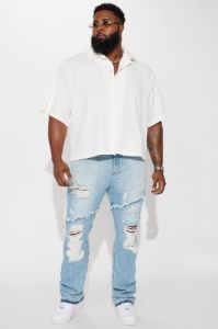 Caught In The Cycle Stacked Skinny Flare Jeans - Light Blue Wash sold by Fashion Nova