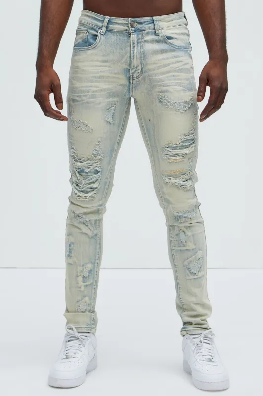 Above It All Ripped Stacked Skinny Jeans - Light Wash made by Fashion Nova