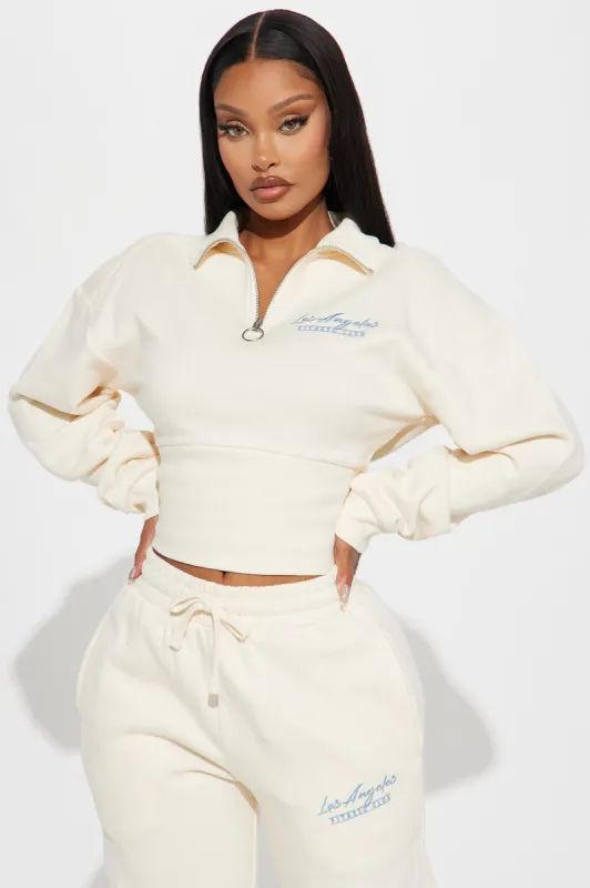 West Coast Quarter Zip Sweatshirt - Ivory sold by Fashion Nova