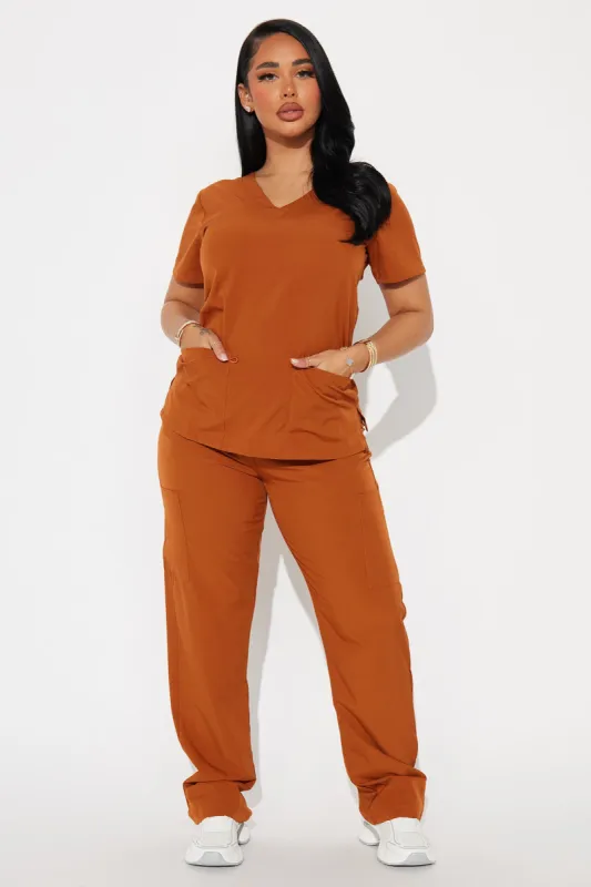 Working Overtime 4FLEX Uniform Scrub Pants - Brown sold by Fashion Nova