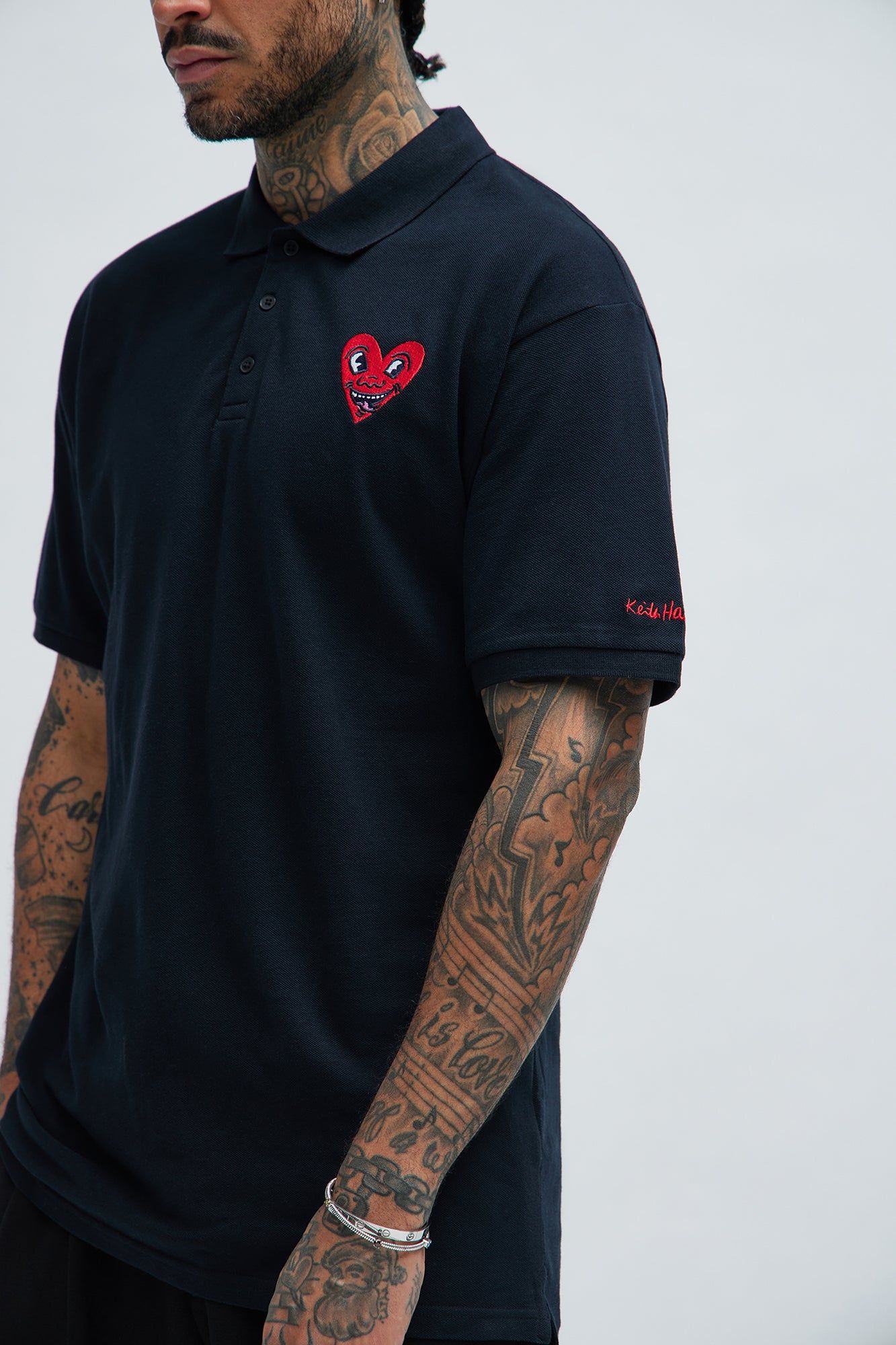 Keith Haring Heart Logo Short Sleeve Polo - Black sold by Fashion Nova product image thumbnail 3