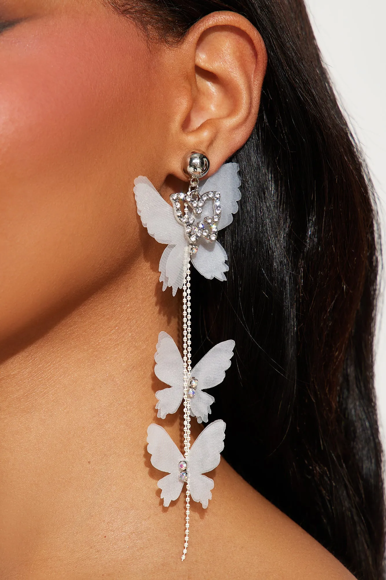 Keep Dreaming Butterfly Earrings - White/Silver sold by Fashion Nova