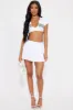 Sharon Pleated Skort - White sold by Fashion Nova