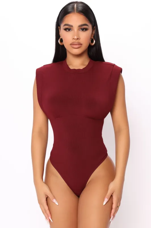 Kayla Shoulder Pad Bodysuit - Wine sold by Fashion Nova