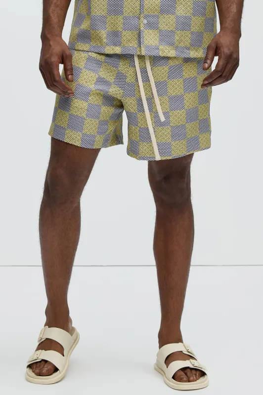 Checkered Print Warm Up Shorts - Yellow/combo sold by Fashion Nova