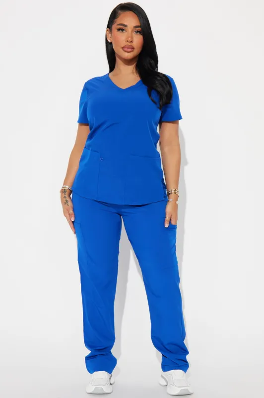 Working Overtime 4FLEX Uniform Scrub Top - Royal sold by Fashion Nova