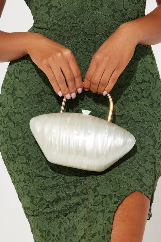 Swirling Through The Day Clutch - Ivory sold by Fashion Nova