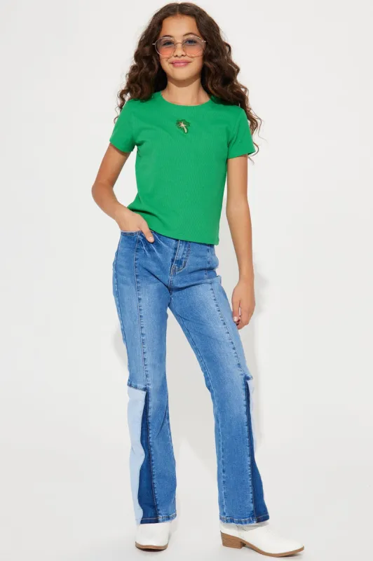 Mini Denim inserts in a Flare Jean - Medium Wash sold by Fashion Nova