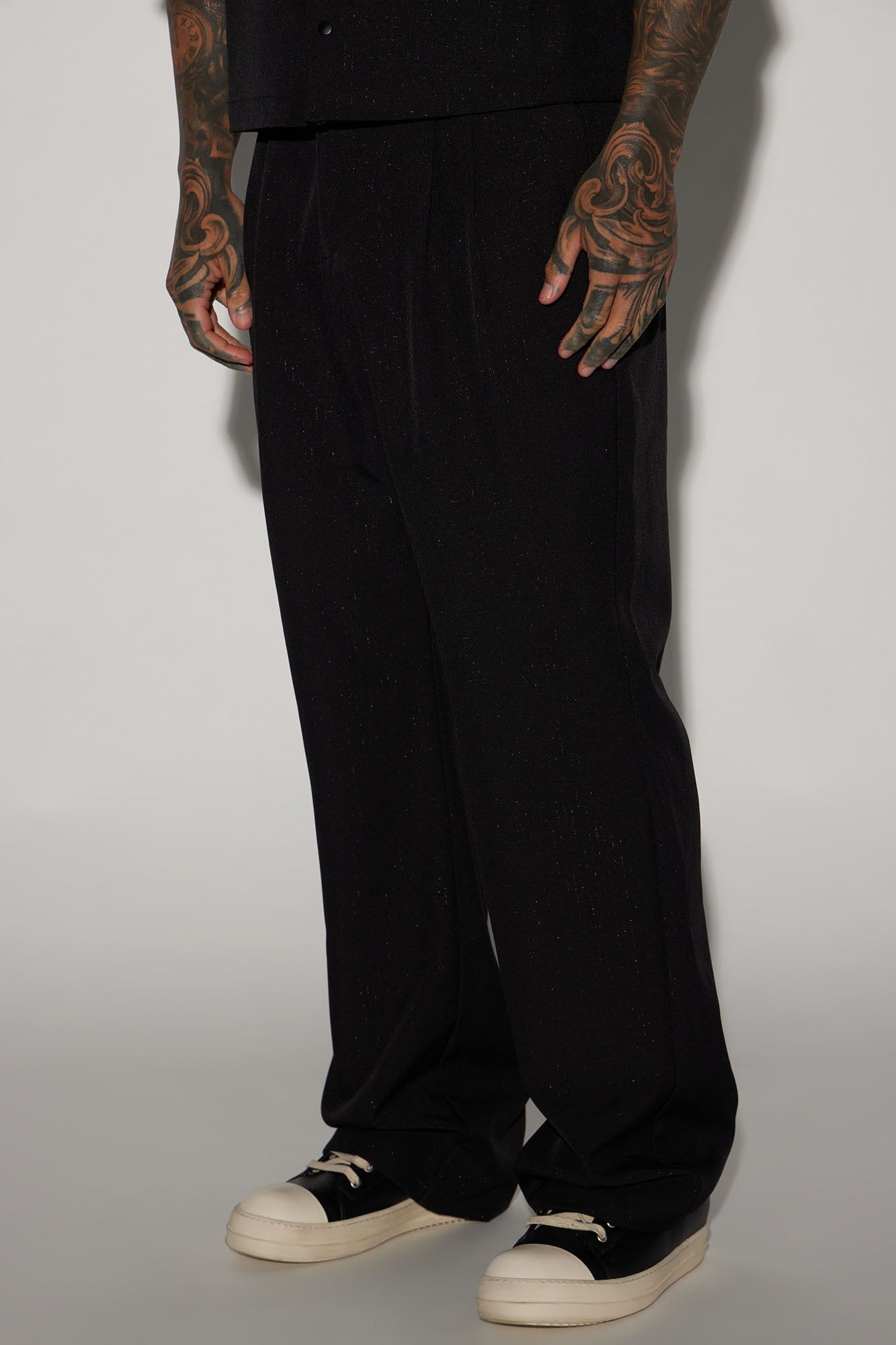 Universal Relaxed Flare Trousers - Black sold by Fashion Nova
