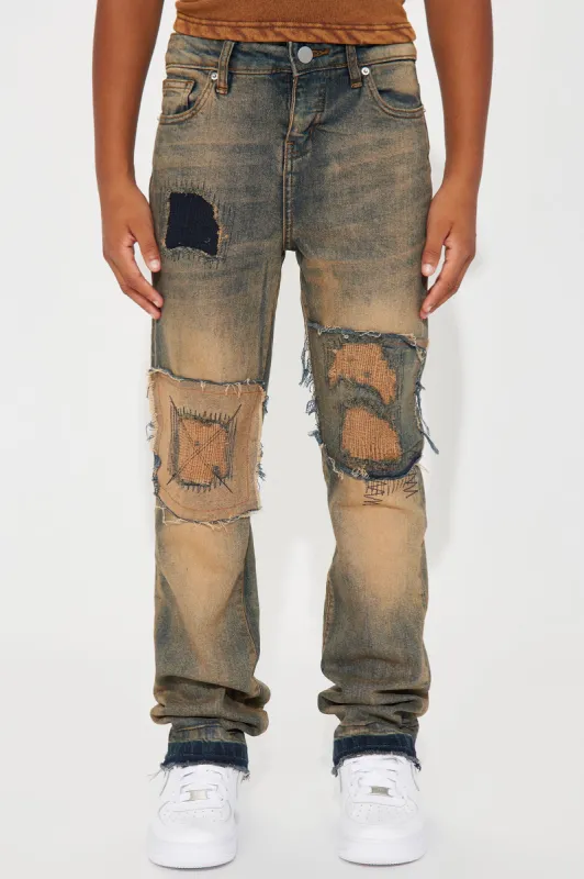 Mini Ripped And Repaired Slim Jeans - Vintage Blue Wash sold by Fashion Nova