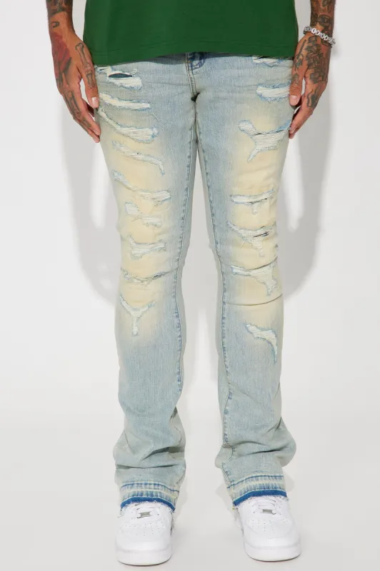 Keep It Going Stacked Skinny Flare Jeans - Light Wash sold by Fashion Nova