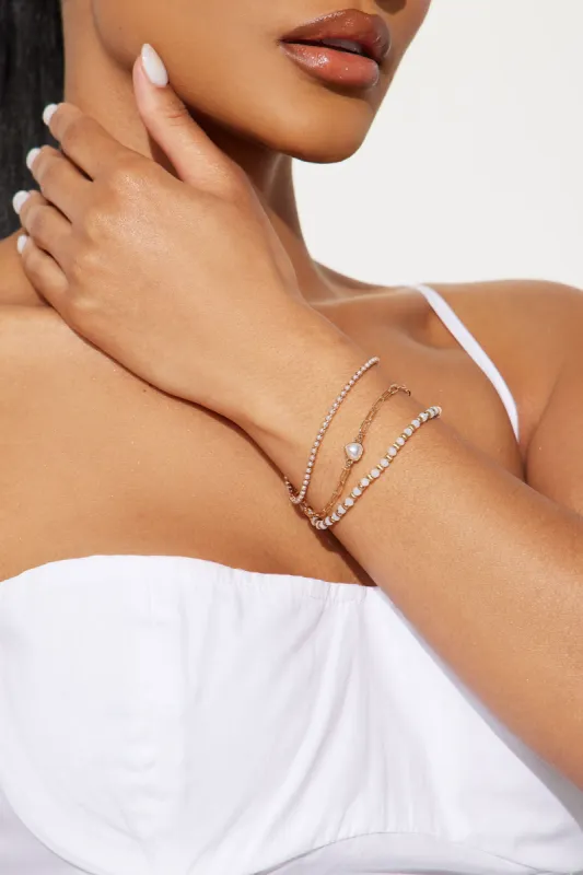 Pearl Heart Glow 3 Piece Bracelet Set - Clear/Gold sold by Fashion Nova