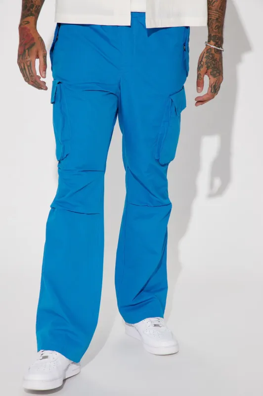 Slim Flare Cargo Parachute Pants - Blue sold by Fashion Nova