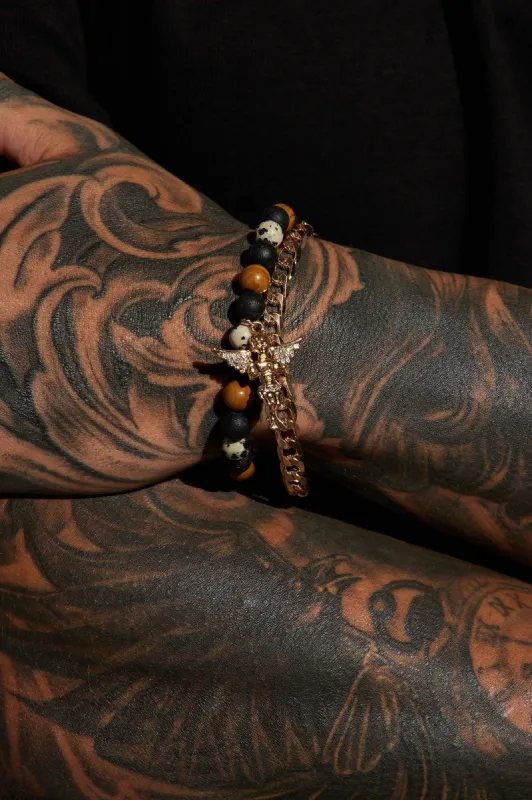 Fallen Angel Bracelet Set - Gold/Black sold by Fashion Nova