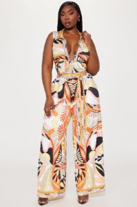 This Energy Jumpsuit  - Yellow/combo sold by Fashion Nova