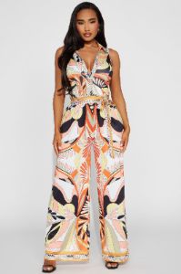 This Energy Jumpsuit  - Yellow/combo sold by Fashion Nova