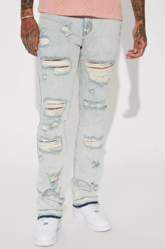 Playing With My Emotions Distressed Stacked Skinny Flare Jeans - Light Blue Wash sold by Fashion Nova