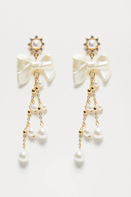 Bow And Tea Drop Earrings - Gold sold by Fashion Nova