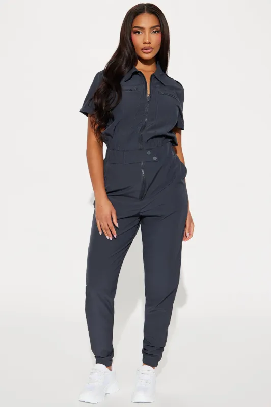 On Call Stretch Uniform Scrub Jumpsuit - Charcoal sold by Fashion Nova