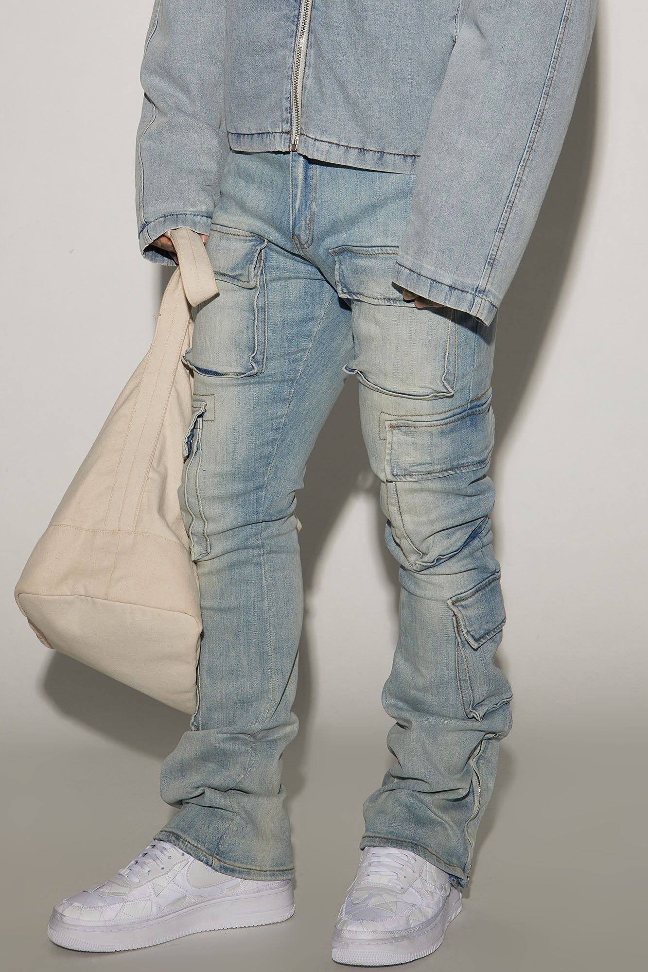 Three Cargo Stacked Skinny Zipper Flare Jeans - Light Wash sold by Fashion Nova