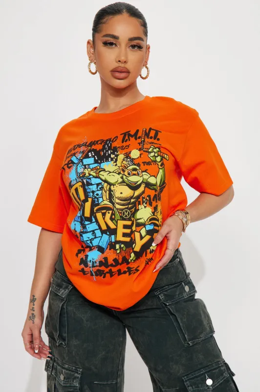 Mikey The Ninja Turtle Graphic Tshirt - Orange sold by Fashion Nova
