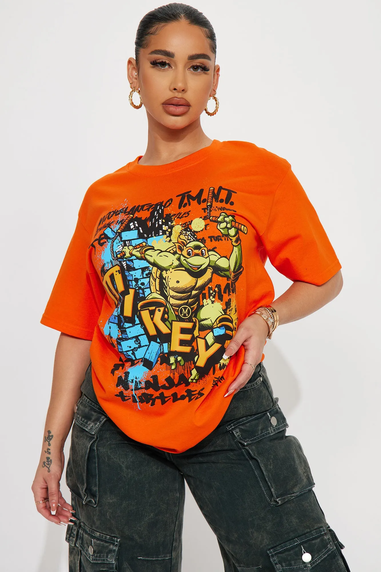 Mikey The Ninja Turtle Graphic Tshirt - Orange sold by Fashion Nova