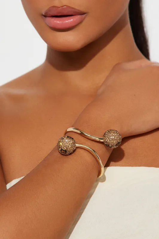 Don't Get It Twisted Cuff Bracelet - Gold/Brown sold by Fashion Nova