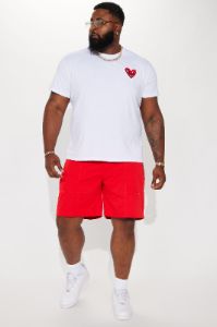 Keith Haring Heart Logo Short Sleeve Tee - White sold by Fashion Nova