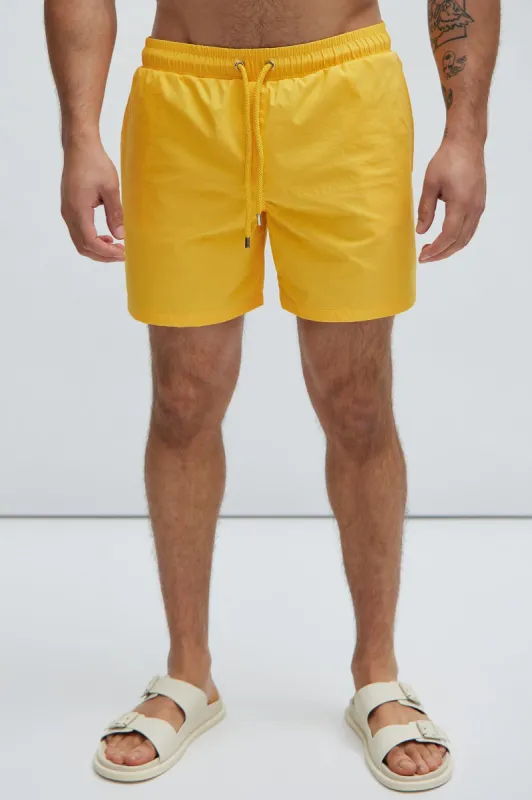 Montez Stretch Swim Trunk Mid - Mustard sold by Fashion Nova