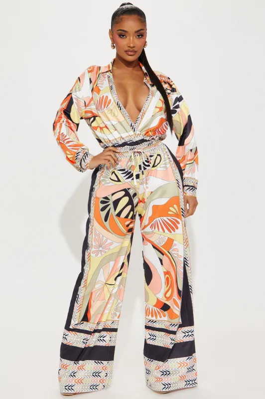 Penelope Printed Jumpsuit - Orange/combo sold by Fashion Nova