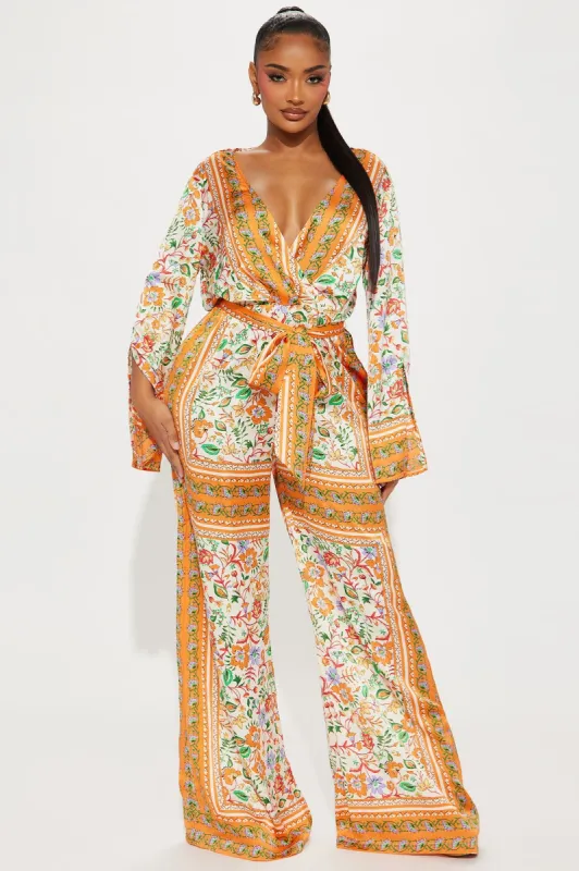 Aruba Sun Jumpsuit - Orange/combo sold by Fashion Nova