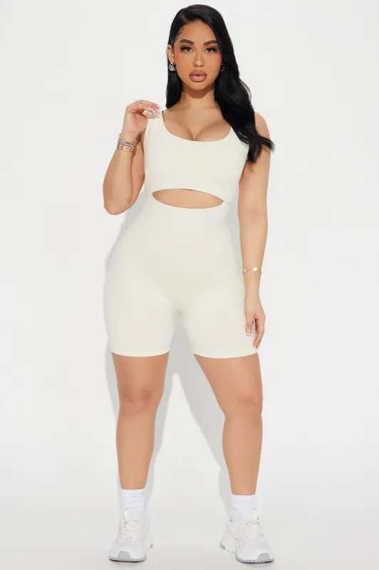 Fast Cycle Active Romper - Cream sold by Fashion Nova
