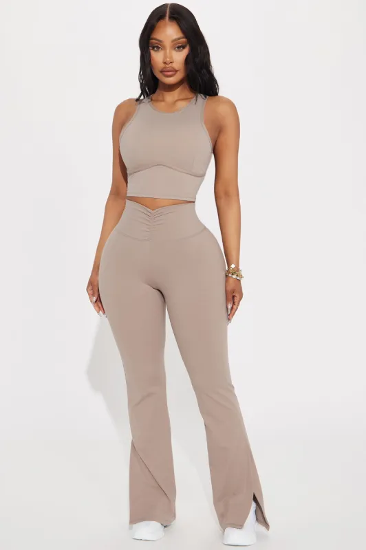 Pilates Girl Active Flare Pant - Taupe sold by Fashion Nova