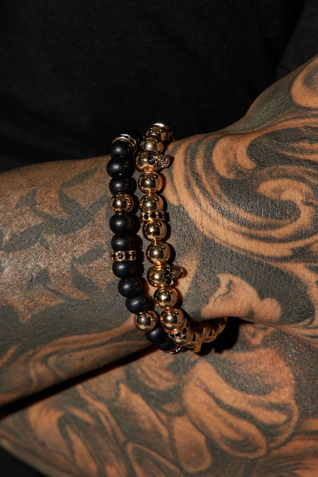 Skull Head 2 Piece Bracelet Set - Gold/Black sold by Fashion Nova