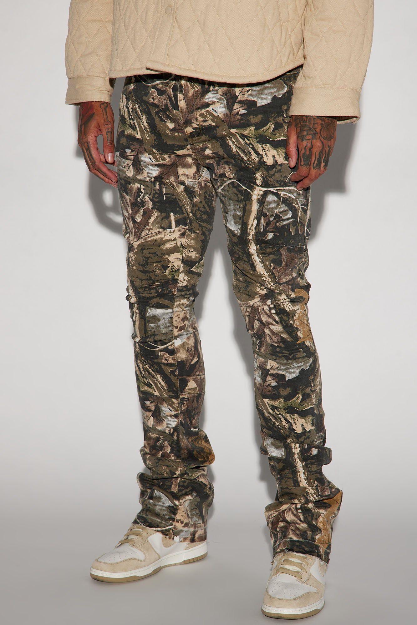 Been This Way Stacked Skinny Flare Pants - Camouflage sold by Fashion Nova