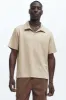 Kalel Textured Short Sleeve Polo - Tan sold by Fashion Nova