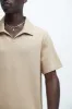 Kalel Textured Short Sleeve Polo - Tan sold by Fashion Nova