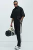 Dix Gabardine Slim Flare Trousers - Black/combo sold by Fashion Nova
