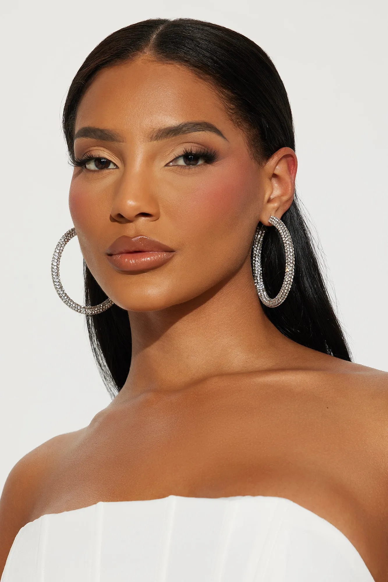 The Blingiest One Around Hoop Earrings - Silver sold by Fashion Nova