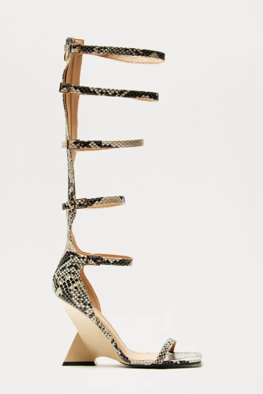 In A Trance Novelty Heels - Taupe/combo sold by Fashion Nova