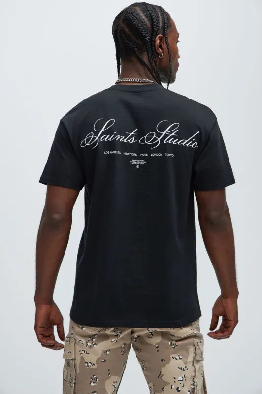 Saints Studio Worldwide Short Sleeve Tee - Black sold by Fashion Nova
