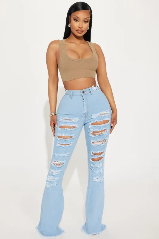 Perfect Storm Shredded Stretch Flare Jeans - Light Wash sold by Fashion Nova