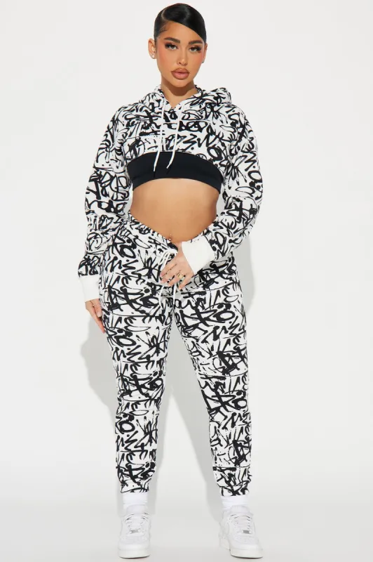 The Extra Mile Jogger Set - White/Black sold by Fashion Nova