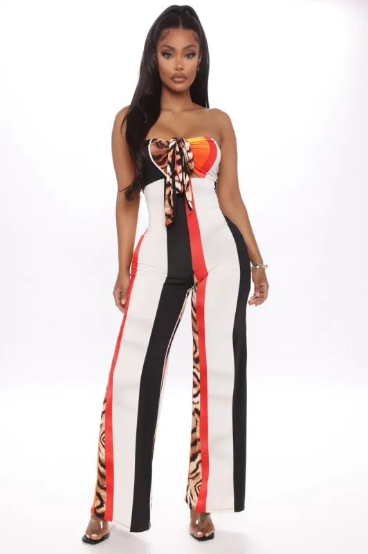 Play Out Of Control Jumpsuit - Orange/combo sold by Fashion Nova