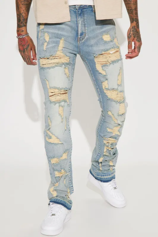 Torn Apart Stacked Skinny Flare Jeans - Light Blue Wash sold by Fashion Nova